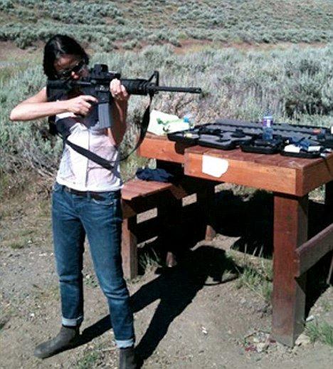 Demi Moore shooting a gun